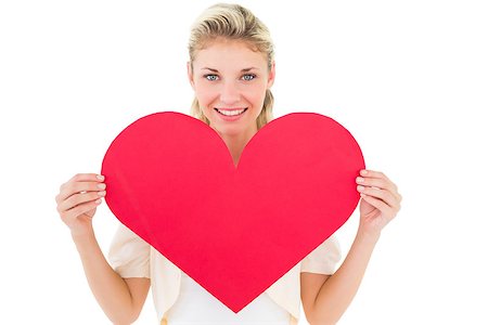 simsearch:400-07726694,k - Attractive young blonde showing red heart on white background Foto de stock - Royalty-Free Super Valor e Assinatura, Número: 400-07686520