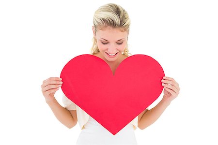 simsearch:400-07686530,k - Attractive young blonde showing red heart on white background Foto de stock - Royalty-Free Super Valor e Assinatura, Número: 400-07686521