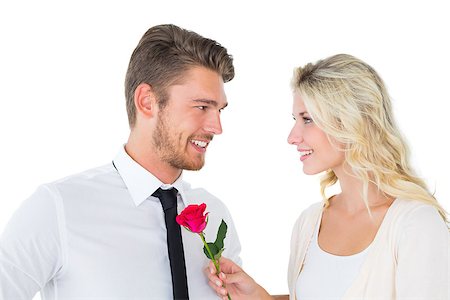 simsearch:400-07686530,k - Handsome man smiling at girlfriend holding a rose on white background Foto de stock - Royalty-Free Super Valor e Assinatura, Número: 400-07686536