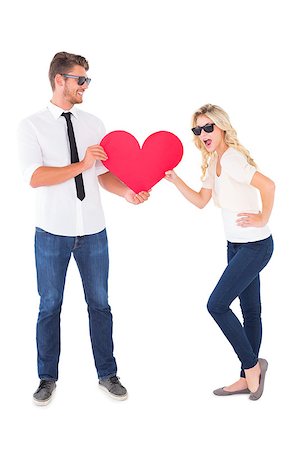simsearch:400-07726694,k - Cool young couple holding red heart on white background Foto de stock - Royalty-Free Super Valor e Assinatura, Número: 400-07686533