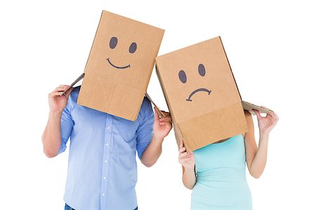 Couple wearing sad face boxes on their heads on white background Stock Photo - Budget Royalty-Free & Subscription, Code: 400-07686559