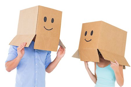 Couple wearing emoticon face boxes on their heads on white background Stock Photo - Budget Royalty-Free & Subscription, Code: 400-07686562