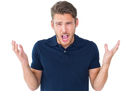 someone shrugging their shoulders - Handsome young man shrugging shoulders on white background Stock Photo - Budget Royalty-Free & Subscription, Code: 400-07686636