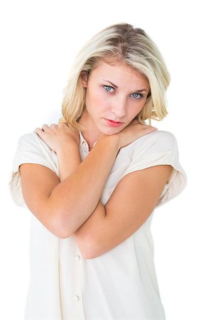 simsearch:400-07778671,k - Sad pretty blonde looking at camera on white background Fotografie stock - Microstock e Abbonamento, Codice: 400-07686672