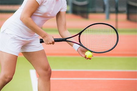 Focused tennis player ready to serve on a sunny day Stock Photo - Budget Royalty-Free & Subscription, Code: 400-07686726
