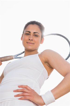 Pretty tennis player holding racket smiling at camera on a sunny day Photographie de stock - Aubaine LD & Abonnement, Code: 400-07686786
