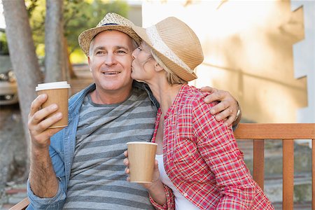 retired couple drinking coffee - Happy mature couple drinking coffee on a bench in the city on a sunny day Stock Photo - Budget Royalty-Free & Subscription, Code: 400-07687804