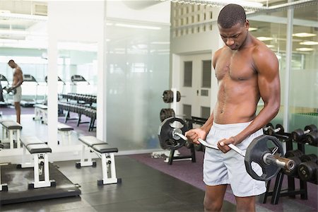 simsearch:400-06208099,k - Determined young shirtless man lifting barbell in gym Photographie de stock - Aubaine LD & Abonnement, Code: 400-07687930