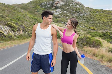 simsearch:400-07688341,k - Portrait of a fit young couple standing on the open road Stock Photo - Budget Royalty-Free & Subscription, Code: 400-07688347