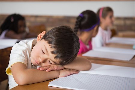 sleeping in a classroom - Sleeping pupil sitting at his desk at the elementary school Stock Photo - Budget Royalty-Free & Subscription, Code: 400-07688649