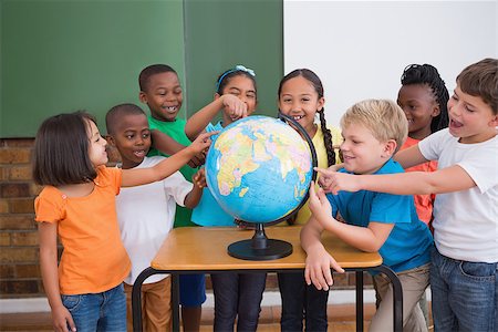 simsearch:400-07991069,k - Cute pupils pointing to globe in classroom at the elementary school Foto de stock - Royalty-Free Super Valor e Assinatura, Número: 400-07688712