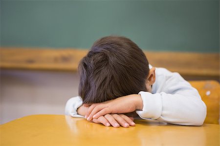 sleeping in a classroom - Sleepy pupil napping at desk in classroom at the elementary school Stock Photo - Budget Royalty-Free & Subscription, Code: 400-07688859