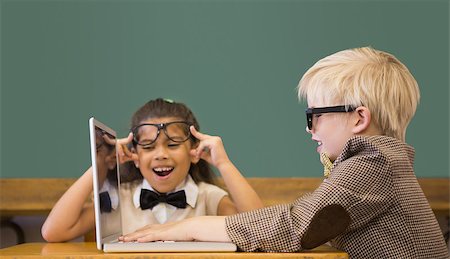 Cute pupils dressed up as teachers in classroom at the elementary school Stock Photo - Budget Royalty-Free & Subscription, Code: 400-07688906