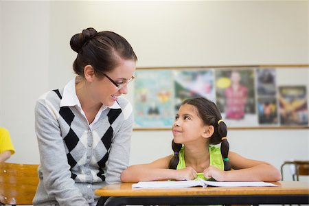 simsearch:400-07684082,k - Pretty teacher helping pupil in classroom at the elementary school Stock Photo - Budget Royalty-Free & Subscription, Code: 400-07688984