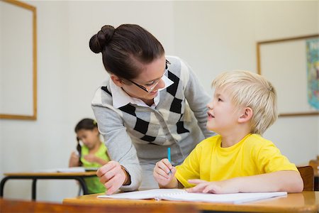 simsearch:400-07684082,k - Pretty teacher helping pupil in classroom at the elementary school Stock Photo - Budget Royalty-Free & Subscription, Code: 400-07688982