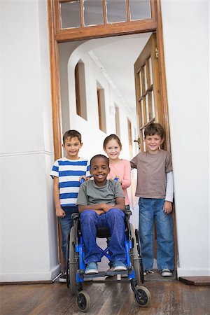 simsearch:400-07991158,k - Disabled pupil with his friends in classroom at the elementary school Stock Photo - Budget Royalty-Free & Subscription, Code: 400-07689005