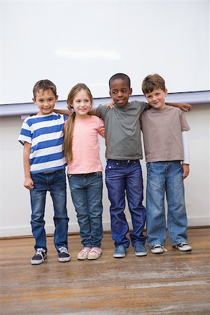 simsearch:400-07991158,k - Classmates smiling at camera in classroom at the elementary school Stock Photo - Budget Royalty-Free & Subscription, Code: 400-07689010