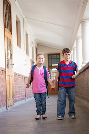simsearch:400-07991158,k - Cute pupils holding hands in corridor at the elementary school Stock Photo - Budget Royalty-Free & Subscription, Code: 400-07689048