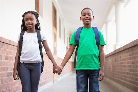 simsearch:400-07991158,k - Cute pupils holding hands in corridor at the elementary school Stock Photo - Budget Royalty-Free & Subscription, Code: 400-07689049