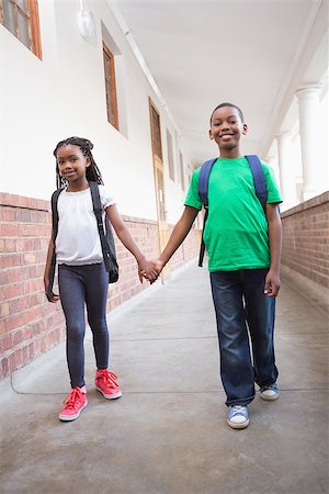 simsearch:400-07991158,k - Cute pupils holding hands in corridor at the elementary school Stock Photo - Budget Royalty-Free & Subscription, Code: 400-07689052