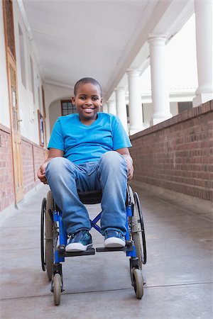 simsearch:400-07991158,k - Cute disabled pupil smiling at camera in hall at the elementary school Stock Photo - Budget Royalty-Free & Subscription, Code: 400-07689076