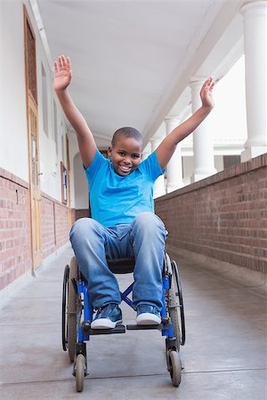 simsearch:400-07991158,k - Cute disabled pupil smiling at camera in hall at the elementary school Stock Photo - Budget Royalty-Free & Subscription, Code: 400-07689077