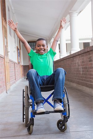 simsearch:400-07991158,k - Cute disabled pupil smiling at camera in hall at the elementary school Stock Photo - Budget Royalty-Free & Subscription, Code: 400-07689079