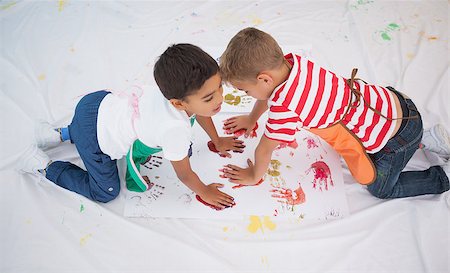 daycare on floor - Cute little boys painting on floor in classroom at the nursery school Stock Photo - Budget Royalty-Free & Subscription, Code: 400-07689172