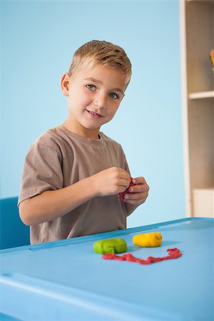 Cute little boy playing with modelling clay in classroom at the nursery school Stock Photo - Budget Royalty-Free & Subscription, Code: 400-07689192