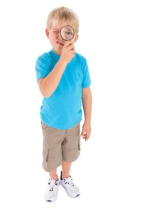 Cute little boy looking through magnifying glass on white background Stock Photo - Budget Royalty-Free & Subscription, Code: 400-07689253