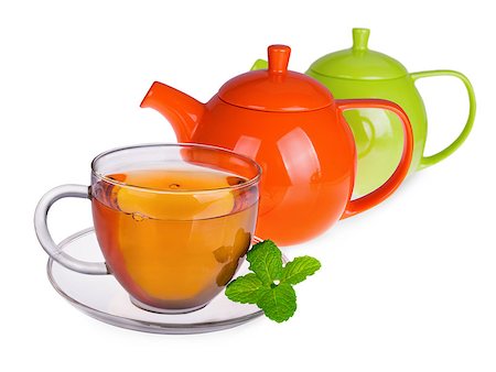 simsearch:400-05215025,k - Glass cup of tea with mint leaves and two  teapots isolated on white background Foto de stock - Royalty-Free Super Valor e Assinatura, Número: 400-07680789