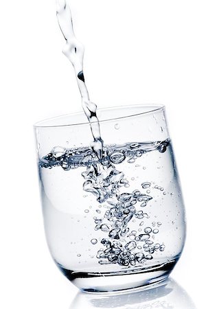 simsearch:400-06918144,k - filling a glass with pure water on white background Stock Photo - Budget Royalty-Free & Subscription, Code: 400-07681019