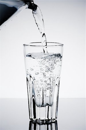 simsearch:400-06918144,k - filling a glass with water showing a drink concept on table Stock Photo - Budget Royalty-Free & Subscription, Code: 400-07681027
