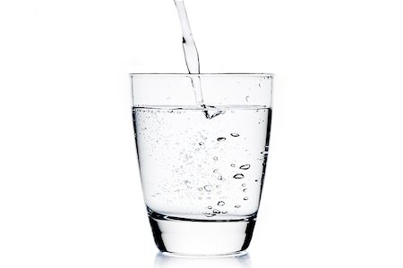 simsearch:400-06918144,k - filling a glass with pure water on white background Stock Photo - Budget Royalty-Free & Subscription, Code: 400-07681031