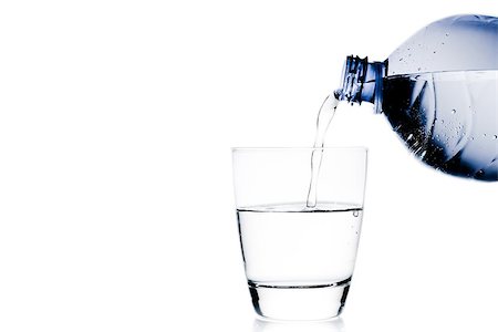 simsearch:400-06918144,k - pouring a glass with water trough blue bottle and space for text on white background Stock Photo - Budget Royalty-Free & Subscription, Code: 400-07681032