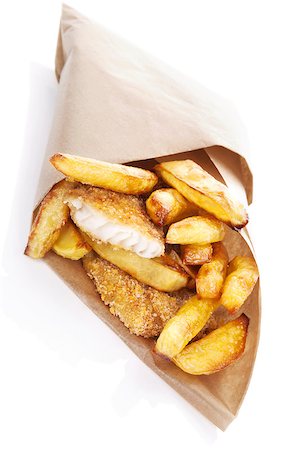 Delicious golden fish and chips in brow bag. Traditional english eating. Unhealthy fast and junk food. Stockbilder - Microstock & Abonnement, Bildnummer: 400-07681061