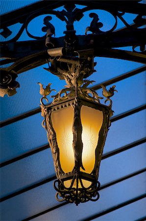 simsearch:400-03948473,k - Old-fashioned Decorative Street Lantern under Blue Roof Outdoors. Night View Foto de stock - Super Valor sin royalties y Suscripción, Código: 400-07682047