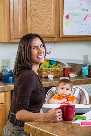 Smiling mother poses with her baby Stock Photo - Budget Royalty-Free & Subscription, Code: 400-07682076