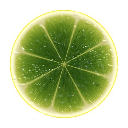 Green slice lime isolated on white background. Fotografie stock - Microstock e Abbonamento, Codice: 400-07682124