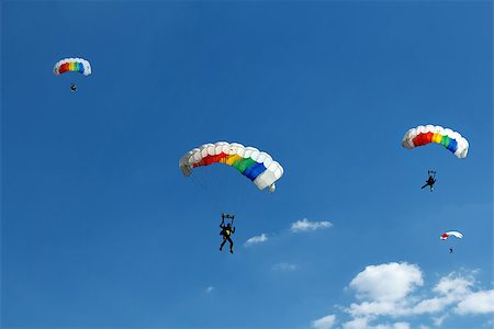 simsearch:400-07666921,k - silhouette of unidentified one skydiver on blue sky Fotografie stock - Microstock e Abbonamento, Codice: 400-07682264