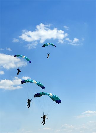 simsearch:400-07666921,k - silhouette of unidentified one skydiver on blue sky Fotografie stock - Microstock e Abbonamento, Codice: 400-07682263