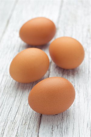 simsearch:400-06640932,k - Eggs stack isolated on a wooden table Stock Photo - Budget Royalty-Free & Subscription, Code: 400-07682328