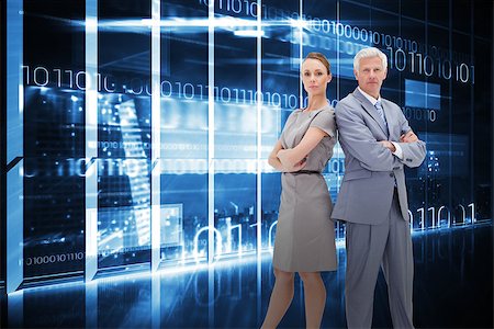 Serious businessman standing back-to-back with a woman  against hologram interface in office overlooking city Stock Photo - Budget Royalty-Free & Subscription, Code: 400-07682783