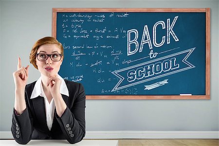 empty classroom wall - Thinking redhead businesswoman against blackboard with copy space on wooden board Stock Photo - Budget Royalty-Free & Subscription, Code: 400-07682884