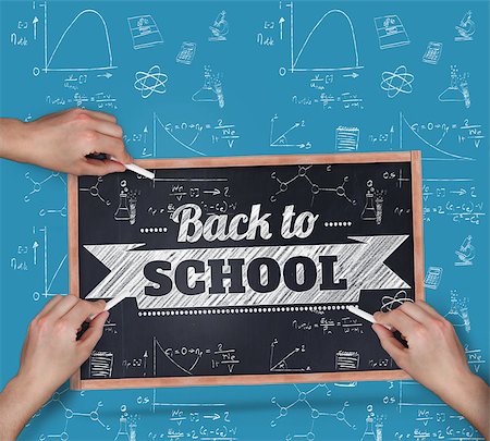 simsearch:400-07682840,k - Multiple hands writing with chalk against black chalkboard Fotografie stock - Microstock e Abbonamento, Codice: 400-07682885