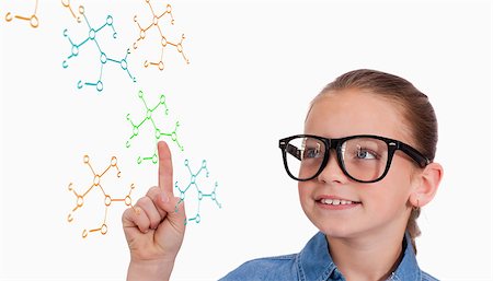 simsearch:400-07682840,k - Cute pupil pointing against rocket science theory Fotografie stock - Microstock e Abbonamento, Codice: 400-07683150