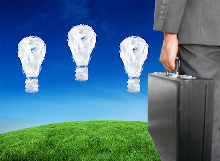 simsearch:6111-06838348,k - Businessman holding briefcase against cloud light bulbs Stock Photo - Budget Royalty-Free & Subscription, Code: 400-07683193