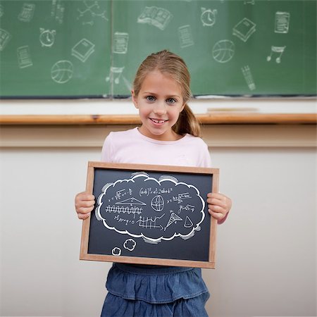 simsearch:400-07682840,k - Math in thought bubble against cute pupil showing chalkboard Fotografie stock - Microstock e Abbonamento, Codice: 400-07683514