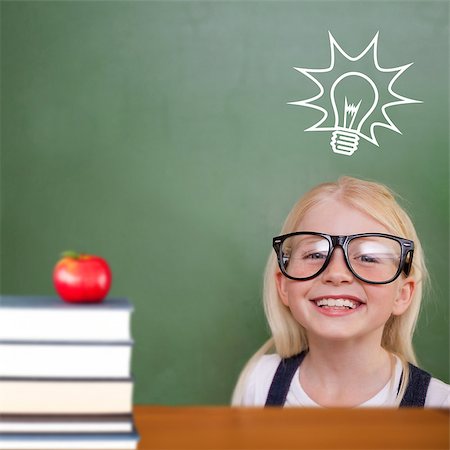 simsearch:400-07684098,k - Cute pupil smiling against red apple on pile of books Stock Photo - Budget Royalty-Free & Subscription, Code: 400-07683543