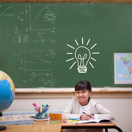 simsearch:400-07683612,k - Idea and innovation graphic against cute pupil sitting at desk Stock Photo - Budget Royalty-Free & Subscription, Code: 400-07683560